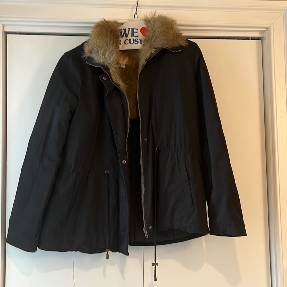 Warm jacket with fur lining neck line